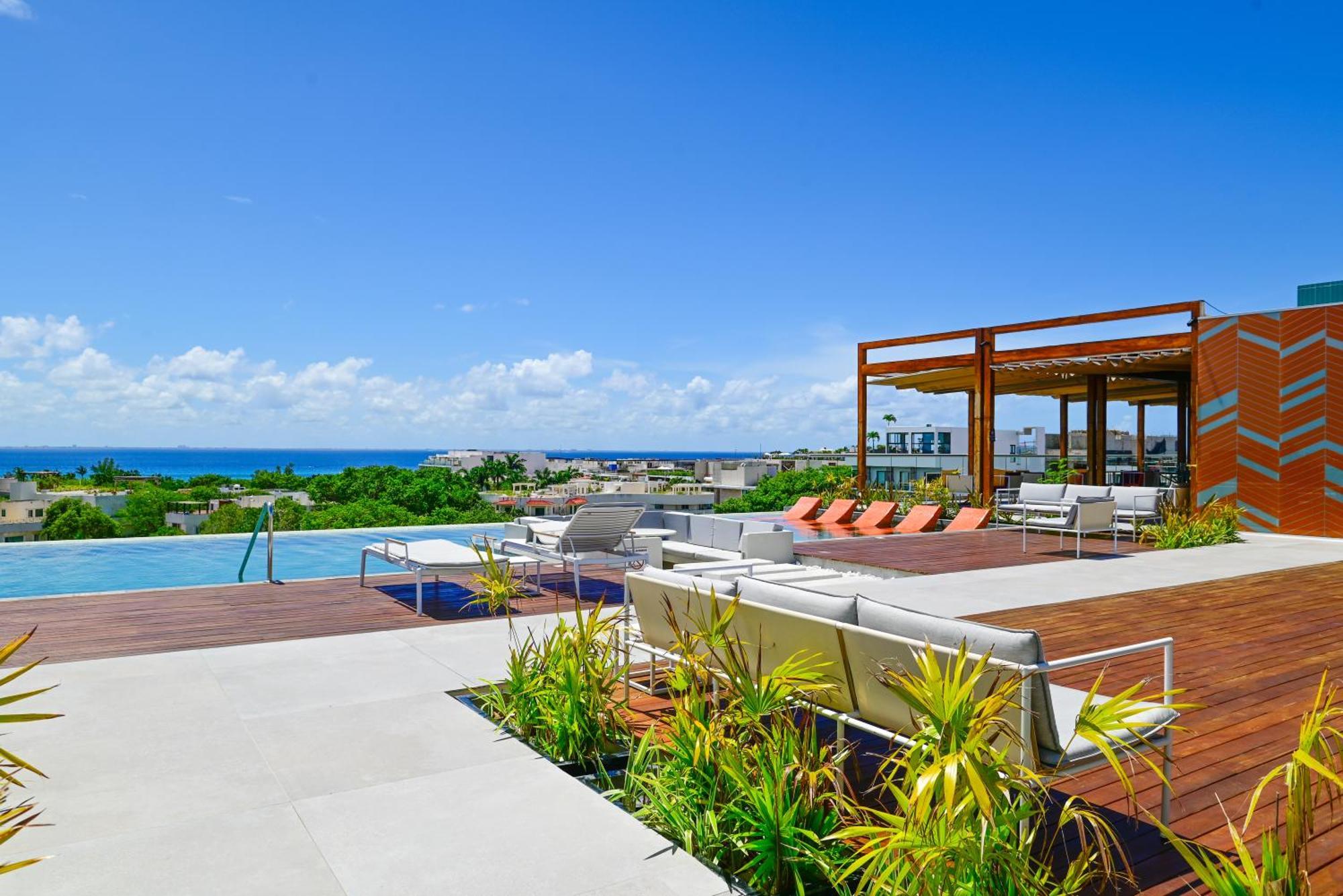 מלון Aloft פלאייה דל כרמן מראה חיצוני תמונה Rooftop pool at the Grand at Moon Palace